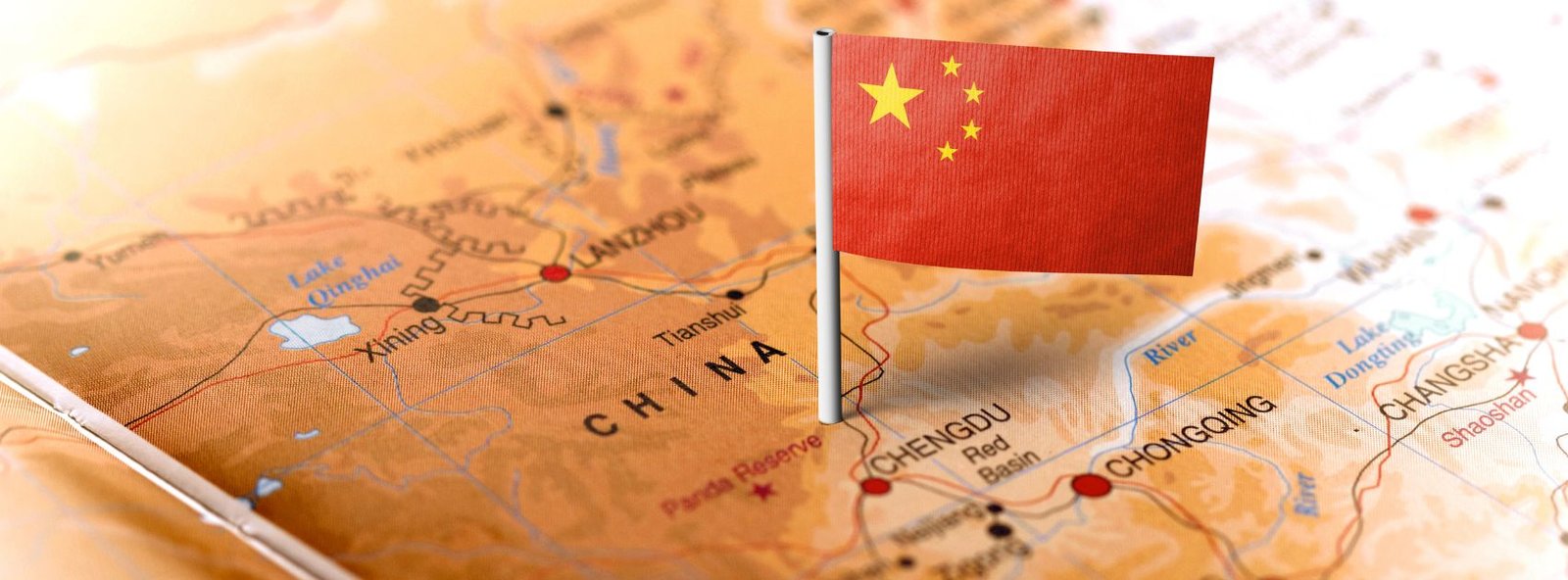 Map of China with it's mini flag pinned on it