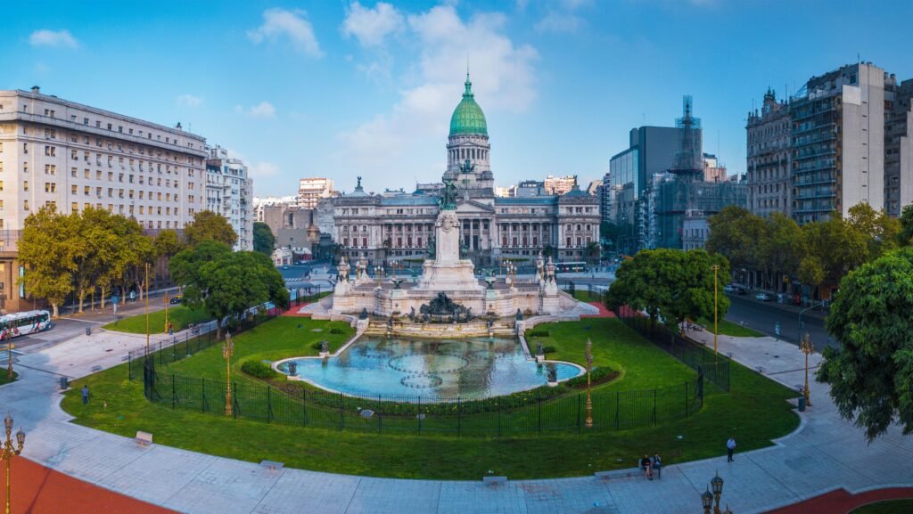 Panoramic view of Buenos Aires city skyline with historic buildings and modern architecture under a clear sky.